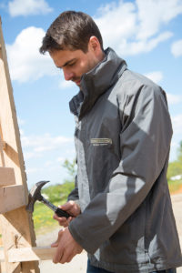 Emmerson Critchley working on the prize outhouse.